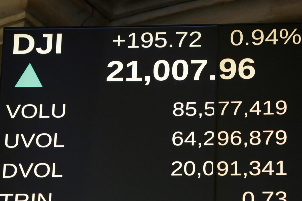 A board above the trading floor of the New York Stock Exchange shows the Dow Jones industrial average above 21,000 on March 1, 2017. (AP Photo/Richard Drew)
