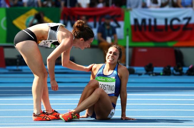 Nikki Hamblin of New Zealand shows good sportsmanship as she helps up Abbey D'Agostino of the United States after a collision during the Women's 5000m at the Rio 2016 Olympic Games. (Ian Walton/Getty Images)