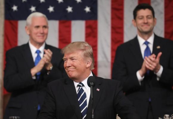 Vice President Mike Pence (L) and Speaker of the House Paul Ryan (R) applaud as U.S. President Donald J. Trump (C) delivers his first address to a joint session of the U.S. Congress in the House chamber of the U.S. Capitol in Washington on Feb. 28, 2017. (Jim Lo Scalzo - Pool/Getty Images)