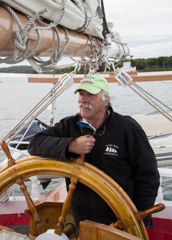 Captain Kip Files at the helm of the Victory Chimes. (Channaly Philipp/Epoch Times)