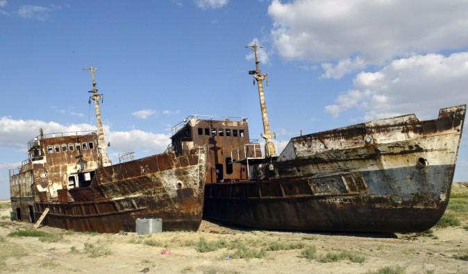 A picture taken 04 August shows rusty shipwrecks pictured at the place called "Sheeps cemetery" in Dzhambul settlement, some 64 kms from town of Aralsk. (VYACHESLAV OSELEDKO/AFP/Getty Images)