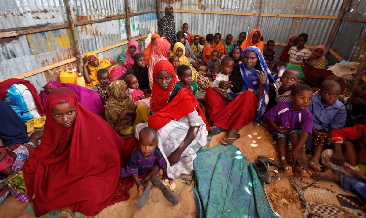 Displaced Somalis who fled the drought in southern Somalia sit in a camp in the capital Mogadishu, Somalia, in this file photo. (AP Photo/Farah Abdi Warsameh, File)