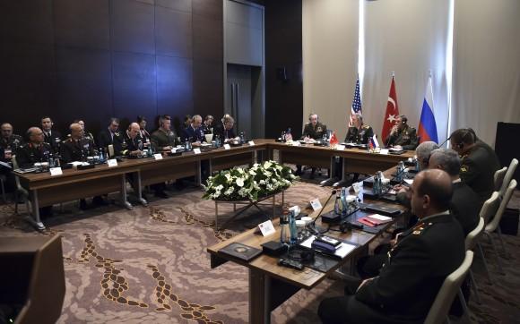 Turkey's military says the Turkish, U.S. and Russian chiefs of military staff are meeting in southern Turkey to discuss developments in Syria and Iraq. The meeting comes amid renewed Turkish threats to hit U.S.-backed Syrian Kurdish targets in the northern Syrian city of Manbij. (Turkish Military, Pool Photo via AP)