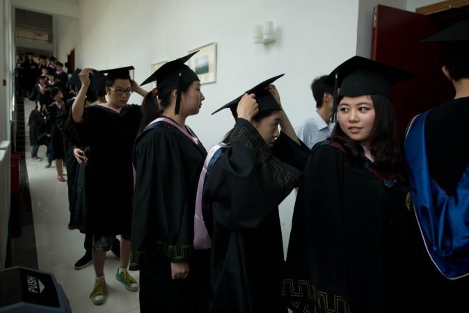 Students line up for their graduation ceremony in Beijing on June 26, 2013. Chinese universities churn out a steady flow of graduates, but rank poorly in terms of scientific publication. (Ed Jones/AFP/Getty Images)