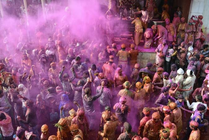 Indian people celebrate Holi, the spring festival of colors, during a traditional gathering in Nandgaon village, India, on March 7, 2017. (/AFP/Getty Images)