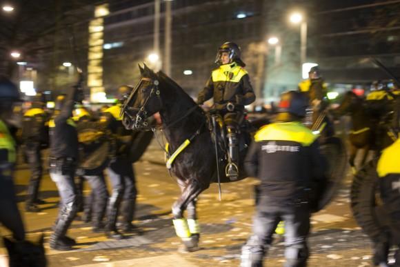 Dutch riot police battle pro Erdogan demonstrators after riots broke out at the Turkish consulate in Rotterdam, Netherlands on March 12, 2017. Turkish Foreign Minister Mevlut Cavusoglu was due to visit Rotterdam on Saturday to campaign for a referendum next month on constitutional reforms in Turkey. The Dutch government says that it withdrew the permission for Cavusoglu's plane to land because of "risks to public order and security." (AP Photo/Peter Dejong)