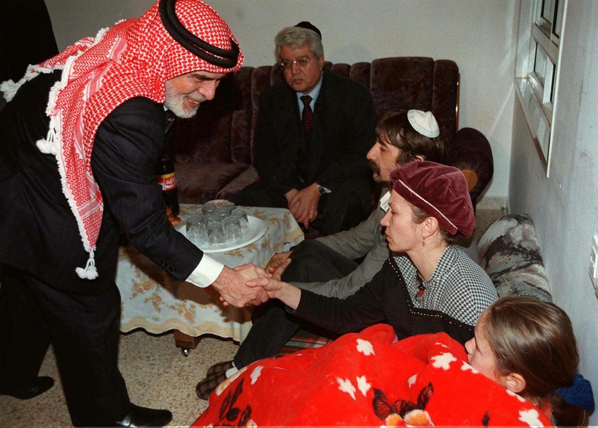 King Hussein of Jordan shakes the hand of members of the Badayev family in Beit Shemesh who are in mourning after their daughter Shiri was killed by a Jordanian soldier on March 16, 1997. (AP PHOTO/GPO/HO)