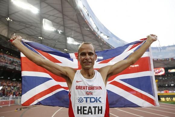 Britain's David Heath celebrates after winning the men's 800 metres masters over-50s athletics ( Adrian Dennis/AFP/Getty Images)