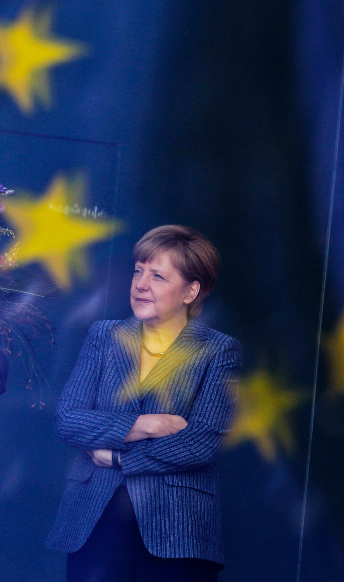 German Chancellor Angela Merkel stands at the chancellery in Berlin on June 2, 2014. (AP Photo/Markus Schreiber)