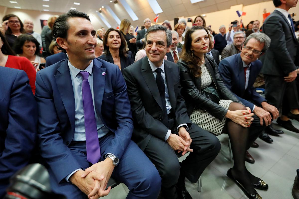Francois Fillon (C), former French prime minister, member of the Republicans political party and 2017 presidential election candidate of the French centre-right, attends at a campaign rally in Pertuis, France, flanked by deputies Valerie Boyer (3L) and Julien Aubert (L), on March 15, 2017. (REUTERS/Charles Platiau)