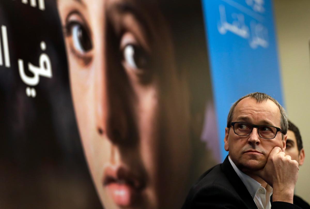 Geert Cappelaere, the U.N. Children's agency (UNICEF) regional director the Middle East and North Africa, watches a video clip on Syrian children during a press conference, in Beirut, Lebanon on March 15, 2017. (AP Photo/Hussein Malla)