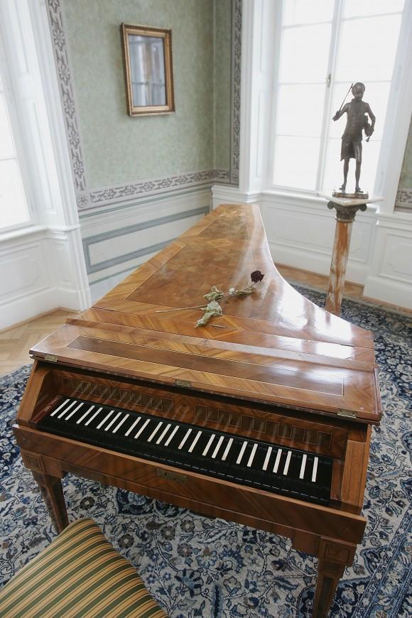 An original harpsichord used by Austrian composer Wolfgang Amadeus Mozart stands next to a statue of him in the room where Mozart stayed and composed on several occasions between 1787 and 1791 at Bertramka Villa on Jan. 22, 2006 in Prague, Czech Republic. Mozart premiered his operas "Don Giovanni" and "La clemeza di Tito" in Prague and also composed several pieces there, including the concert aria "Bella mia fiamma, addio!" (Sean Gallup/Getty Images)