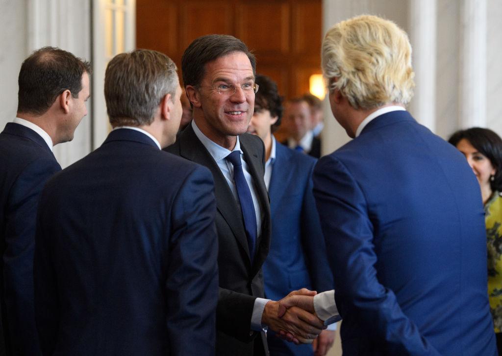 Dutch Prime Minister Mark Rutte shakes hands with Party for Freedom (PVV) leader Geert Wilders during a meeting of Dutch political party leaders at the House of Representatives to express their views on the formation of the cabinet, in The Hague, Netherlands on March 16, 2017. (Carl Court/Getty Images)