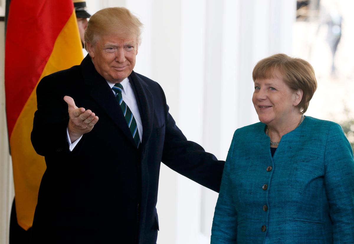 President Trump welcomes German Chancellor Angela Merkel at the White House. (REUTERS/Jim Bourg)