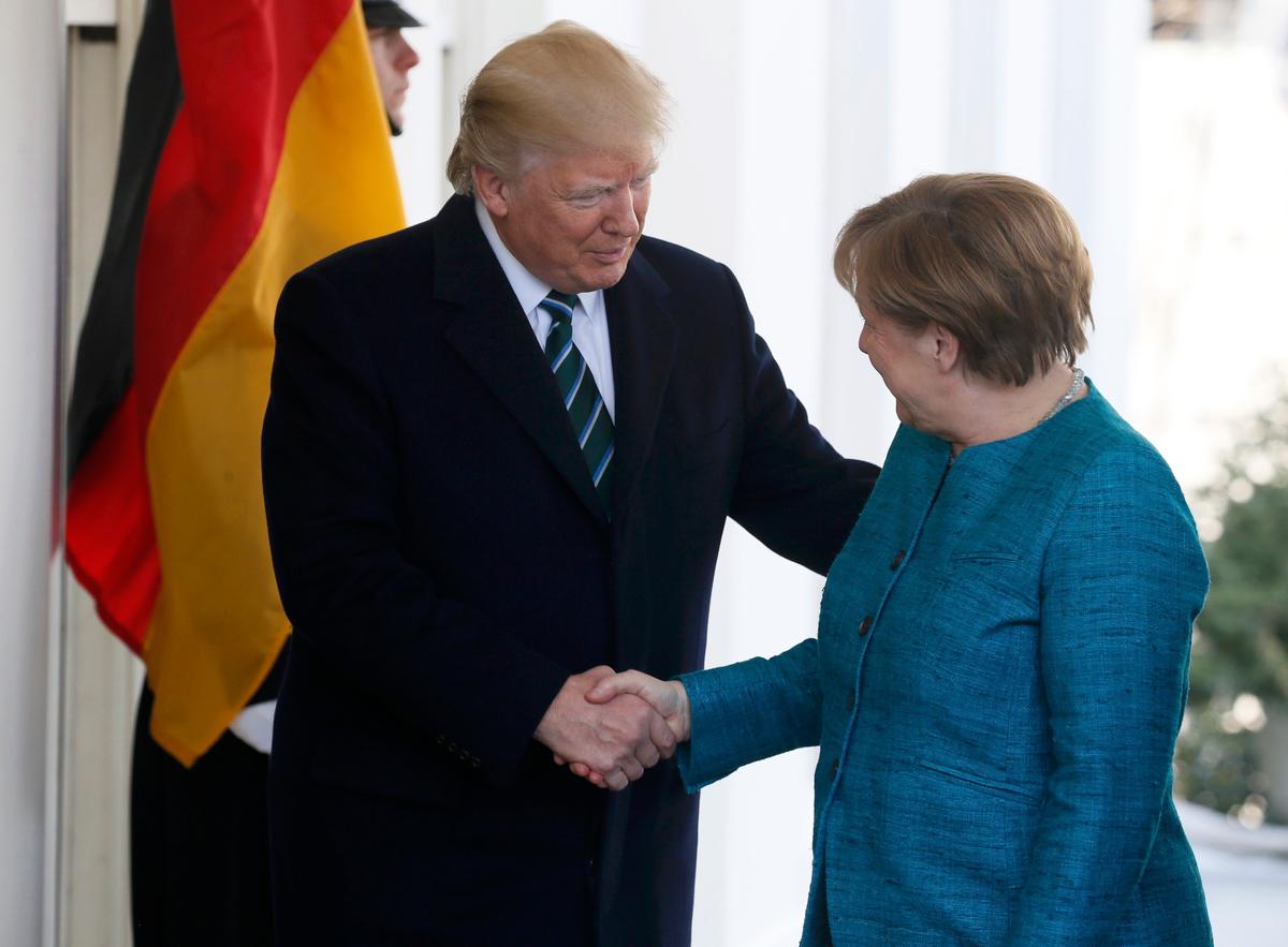 President Trump welcomes German Chancellor Angela Merkel at the White House. (REUTERS/Jim Bourg)