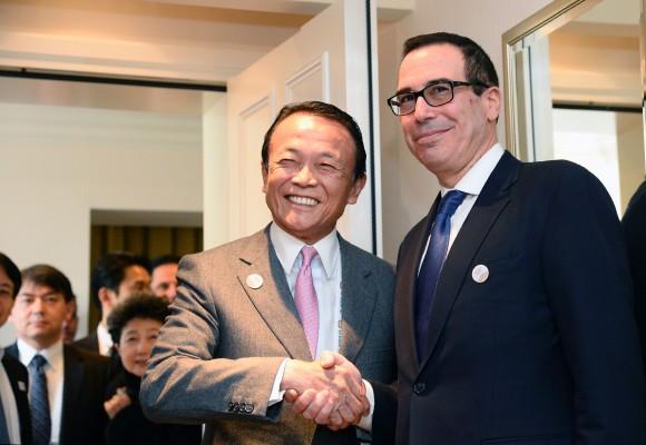 US Secretary of the Treasury Steven Mnuchin (R) shakes hands with Japanase Finance Minister Taro Aso prior to bilateral talks during the G20 Finance Ministers and Central Bank Governors Meeting in Baden-Baden, southern Germany, on March 17, 2017. (THOMAS KIENZLE/AFP/Getty Images)