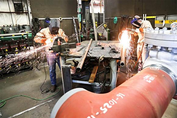 Employees work on building pipes at Pioneer Pipe in Marietta, Ohio, on Oct. 25, 2016. (Spencer Platt/Getty Images)