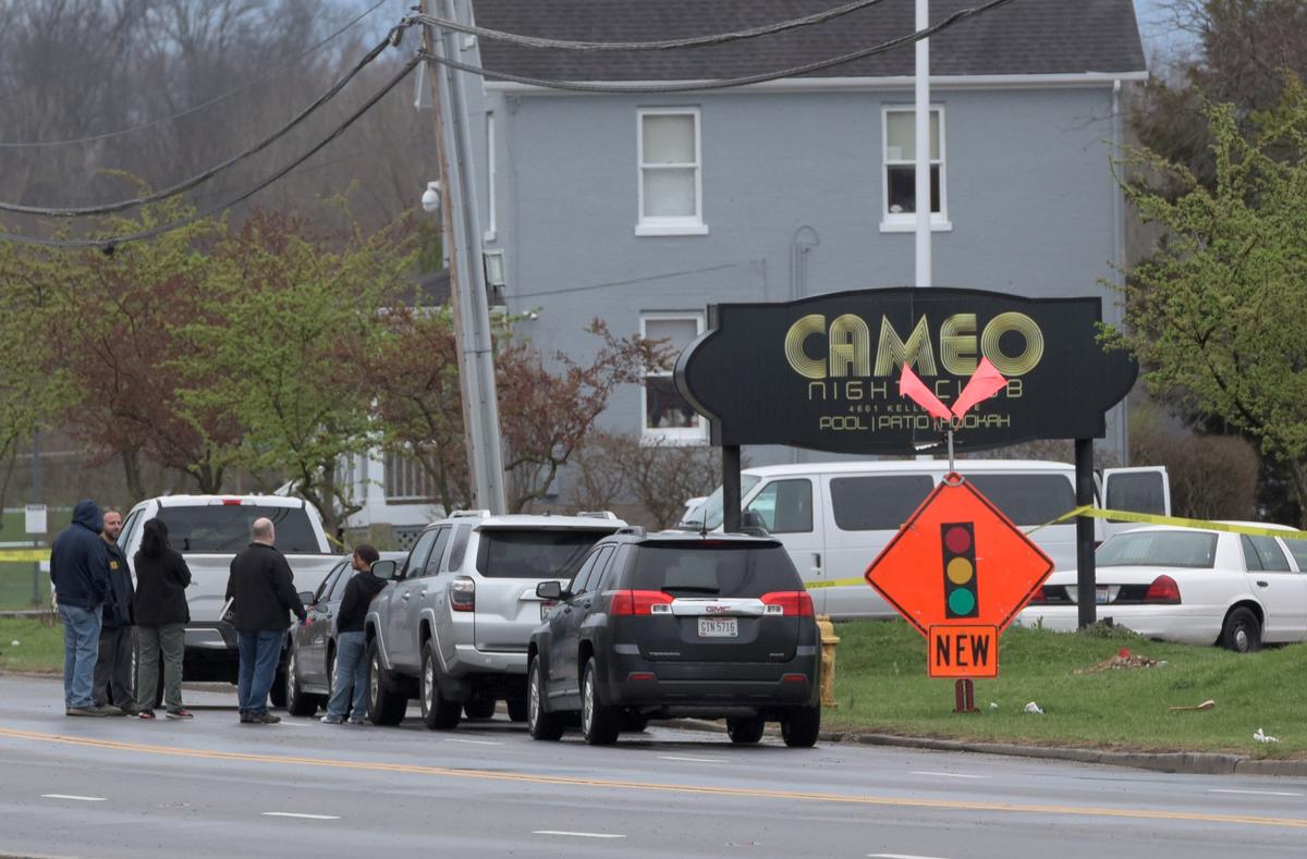 Police and Bureau of Alcohol, Tobacco and Firearms (ATF) personnel attend the scene of a mass shooting at the Cameo Nightlife club in Cincinnati, Ohio on March 26, 2017. (REUTERS/Caleb Hughes)