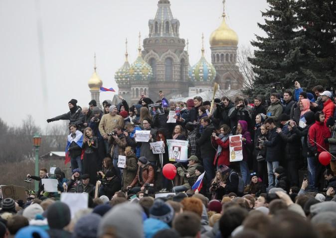 Protesters gather at Marsivo Field in St.Petersburg, Russia, on March 26. Thousands of people crowded in St.Petersburg on Sunday for an unsanctioned protest against the Russian government, the biggest gathering in a wave of nationwide protests that were the most extensive show of defiance in years. (AP Photo/Dmitri Lovetsky)