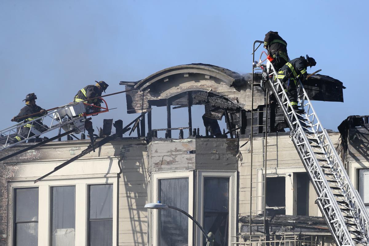 Firefighters battle a four-alarm blaze in a three-story apartment building in Oakland, Calif., on March 27, 2017. (REUTERS/Beck Diefenbach)