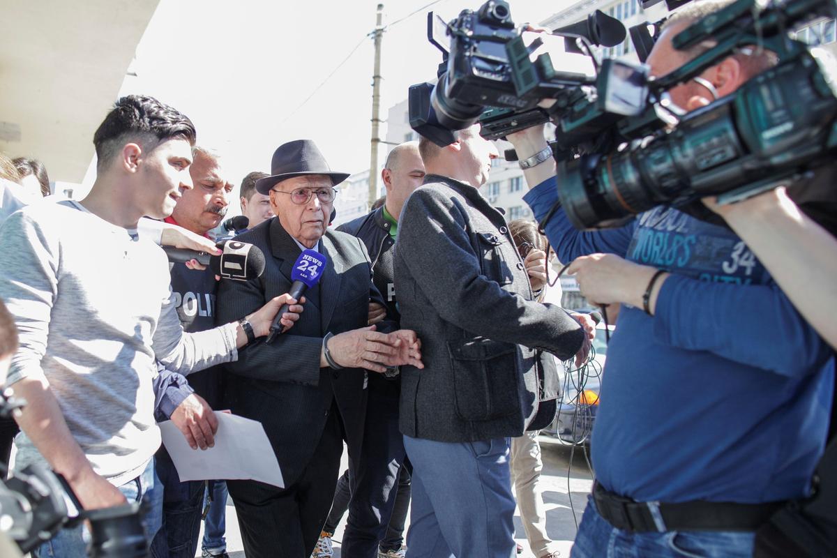 Ioan Ficior, 89, a Romanian communist-era labor prison commander is escorted by police at the end of his trial in Bucharest, Romania on March 29, 2017. (Inquam Photos/Liviu Florin Albei via REUTERS)