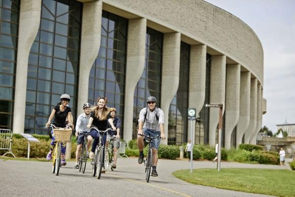 Cyclists ride past the Museum of Canadian History in Gatineau. (Ottawa Tourism)