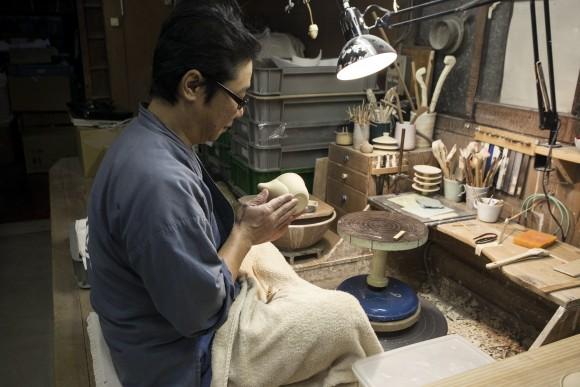 A craftsman makes teaware at the historic Asahiyaki pottery workshop in Uji. (Annie Wu/Epoch Times)
