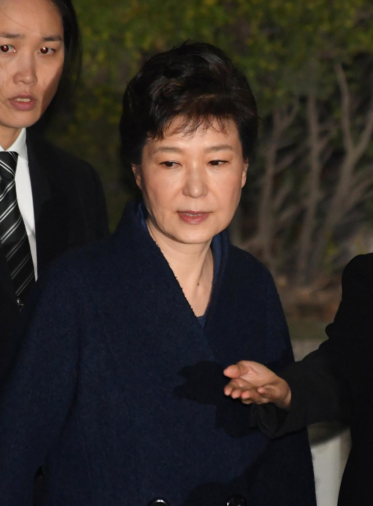 Ousted South Korean President Park Geun-hye, leaves after hearing on a prosecutors' request for her arrest for corruption at the Seoul Central District Court on March 30, 2017. (REUTERS/Song Kyung-Seok/Pool)