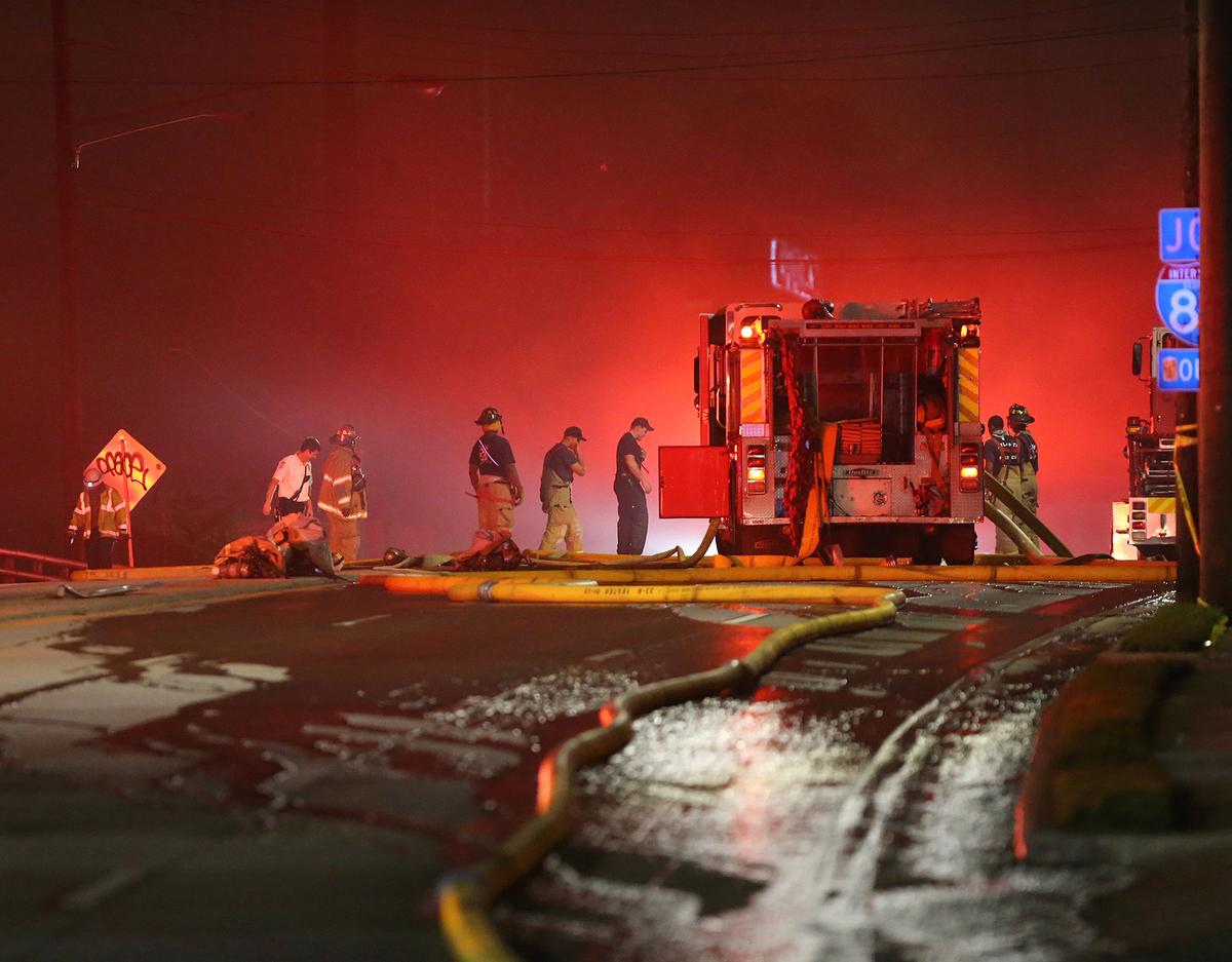Emergency personnel work the scene of a bridge collapse at I-85 in Atlanta, Georgia, U.S., March 30, 2017.<br/>(Courtesy Curtis Compton/Atlanta Journal-Constitution/Handout via REUTERS)