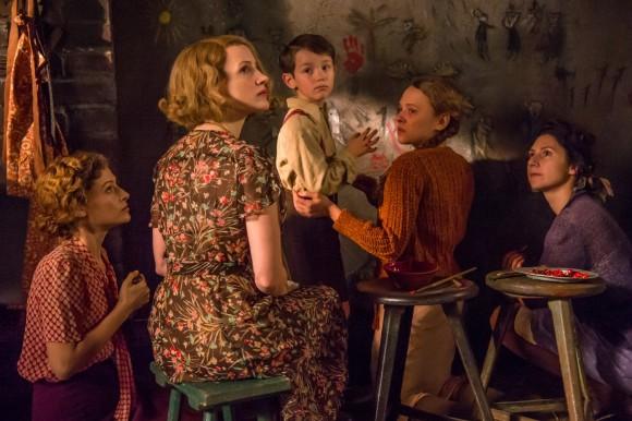 Antonina Zabinski (Jessica Chastain) surrounded by the Jewish women and children she is hiding at the zoo she runs, in "The Zookeeper's Wife." (Scion Films)