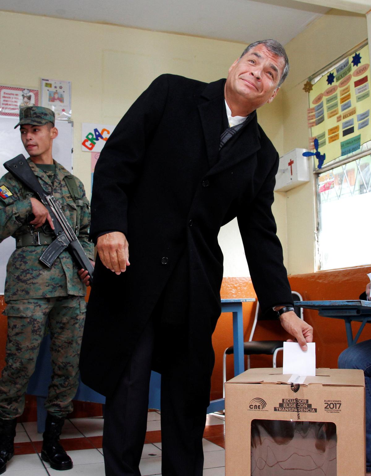 Ecuador's President Rafael Correa casts his vote at school used as a polling station during the presidential election, in Quito, Ecuador on April 2, 2017. (REUTERS/Carlos Noriega)