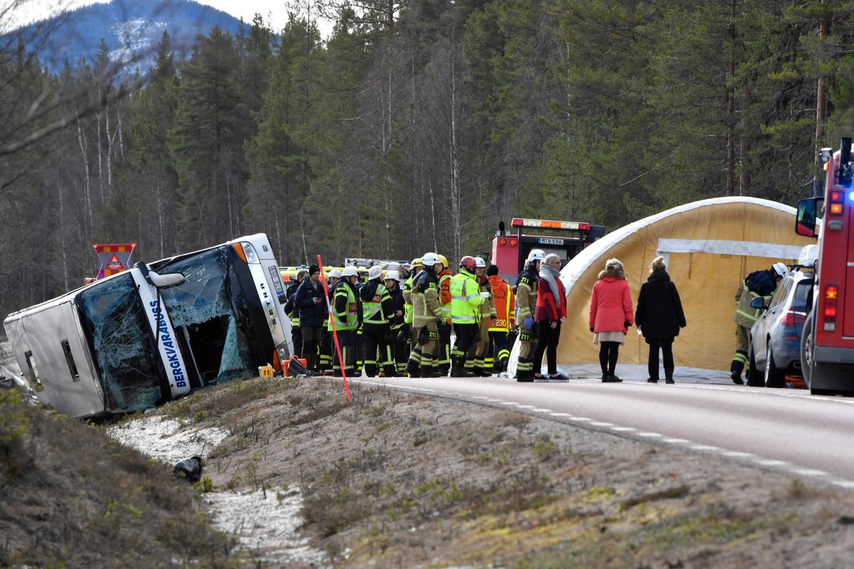 Emergency services and ambulance at the scene of a bus accident, on the E45 between Sveg and Fagelsjo in Sweden on April 2, 2017. (Nisse Schmidt/ TT via AP)