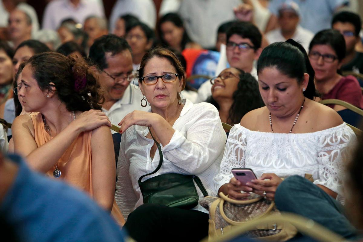 Supporters of Ecuadorian presidential candidate Guillermo Lasso react as they watch the National Election Council's partial official results, which point to a possible victory for socialist candidate Lennin Moreno in the runoff elections, although the final results have not yet been announced, in Guayaquil, Ecuador on April 2, 2017. (JUAN CEVALLOS/AFP/Getty Images)