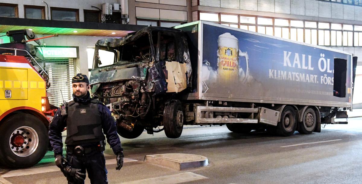 Tow trucks pull away the beer truck that crashed into the department store Ahlens after plowing down the Drottninggatan Street in central Stockholm, Sweden on April 8, 2017. (Maja Suslin/TT News Agency/via Reuters)