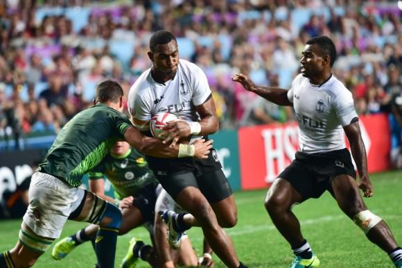 Mesulame Kunavula of Fiji pushes forward to score their 2nd try in the Cathay Pacific/HSBC Sevens final at HK Stadium So Kon Po on Sunday April 9, 2017. (Bill Cox/Epoch Times)