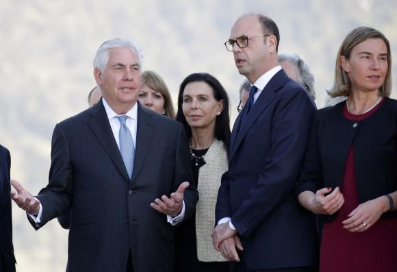 Secretary of State Rex Tillerson (L) gestures as he talks with Italy's Foreign Minister Angelino Alfano (C) and E.U. High Representative for Foreign Affairs Federica Mogherini (R) during a ceremony at the Sant'Anna di Stazzema memorial, dedicated to the victims of the massacre committed in the village of Sant'Anna di Stazzema by the Nazis in 1944 during World War II, Italy April 10, 2017. (REUTERS/Max Rossi)