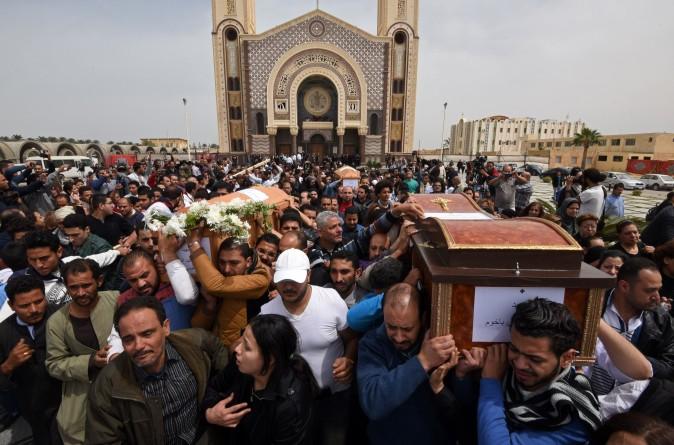 Mourners carry the coffins of victims of the suicide bombing that occurred the previous day at the Coptic Christian Saint Mark's Church, killing at least 44, during a funeral procession in Borg El-Arab, Egypt, on April 10, 2017. (Mohamed El-Shahed/AFP/Getty Images)