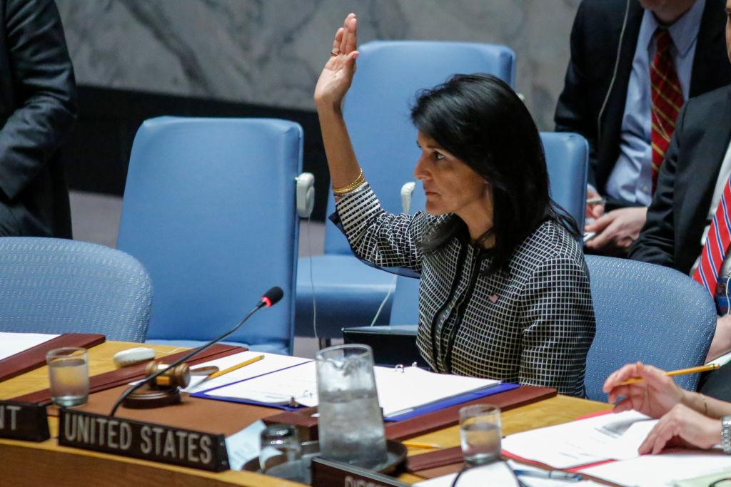 US Ambassador to the UN Nikki Haley holds up her hand as she votes in favor on a Draft resolution that condemns the reported use of chemical weapons in Syria at the Security Council at UN Headquarters in New York on April 12, 2017.<br/>(KENA BETANCUR/AFP/Getty Images)