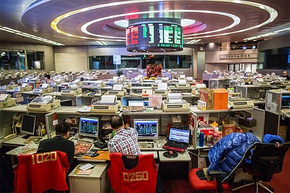 Traders on the trading floor of the stock exchange in Hong Kong on Feb. 3, 2016. The exchange's Q1 2017 IPO value of $5.3 billion is its lowest in 11 years. (ANTHONY WALLACE/AFP/Getty Images)