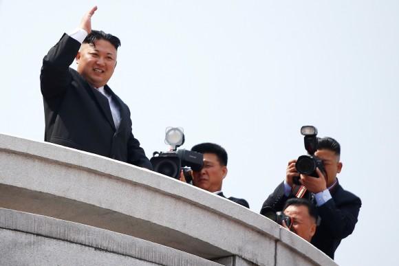 North Korean leader Kim Jong Un waves to people attending a military parade marking the 105th birth anniversary of country's founding father Kim Il Sung, in Pyongyang April 15, 2017. REUTERS/Damir Sagolj)