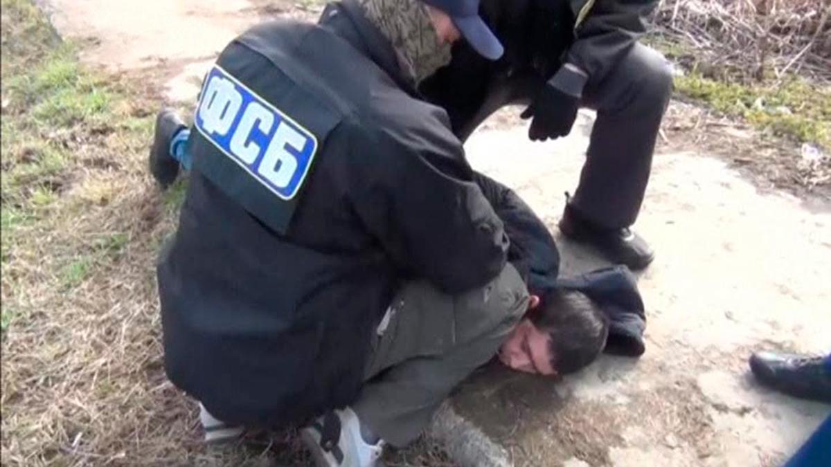 A suspect over the recent bombing of a metro train in St Petersburg, while being detained by FSB officers in Moscow region, Russia on on April 17, 2017. (Russia's Federal Security Service/RBC/Handout via REUTERS TV)