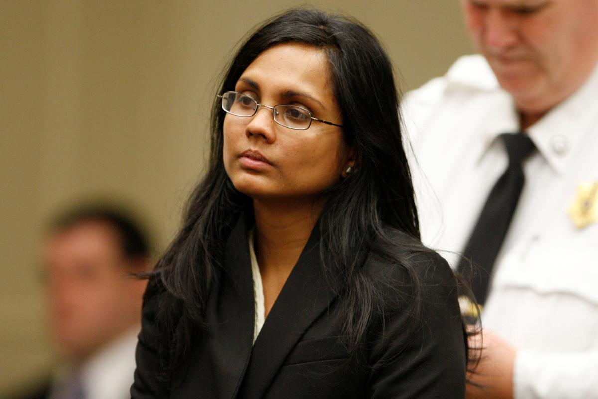 FILE PHOTO: Annie Dookhan, a former chemist at the Hinton State Laboratory Institute, listens to the judge during her arraignment at Brockton Superior Court in Brockton, Massachusetts on Jan. 30, 2013. (REUTERS/Jessica Rinaldi)