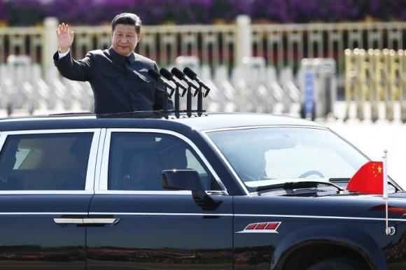 Chinese leader Xi Jinping waves as he reviews the army, at the beginning of the military parade marking the 70th anniversary of the end of World War Two, in Beijing, China on Sep. 3, 2015. (REUTERS/Damir Sagolj)
