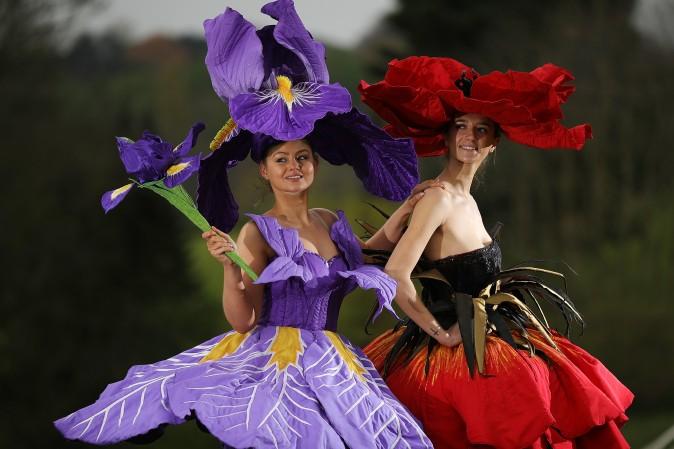 Models Lauren Green (L) and Abi Moore wear an Iris and Poppy flower gowns designed by New Zealand artist Jenny Gillies in Harrogate, England, on April 19, 2017. The flower gowns are just some of the many dresses being displayed at this year's Harrogate Spring Show. (Christopher Furlong/Getty Images)