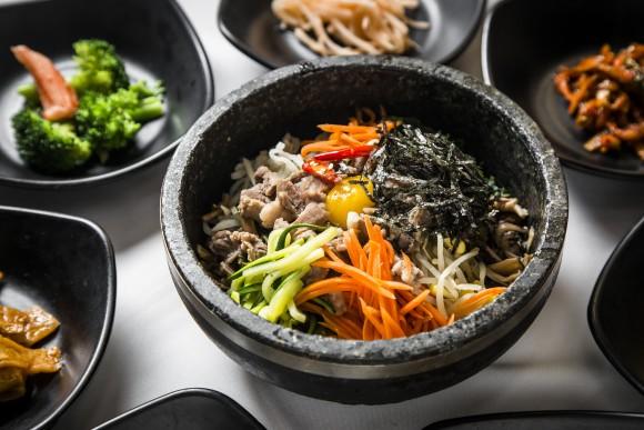 Bibimbap, a popular rice dish with vegetables, is served in a stone pot. (Samira Bouaou/The Epoch Times)