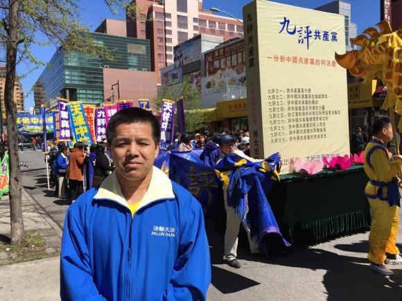 Liu Hong, a Falun Gong practitioner from Shanxi Province who escaped to the United States, joins a parade in Flushing, New York, on April 23, 2017. (Larry Ong/The Epoch Times)