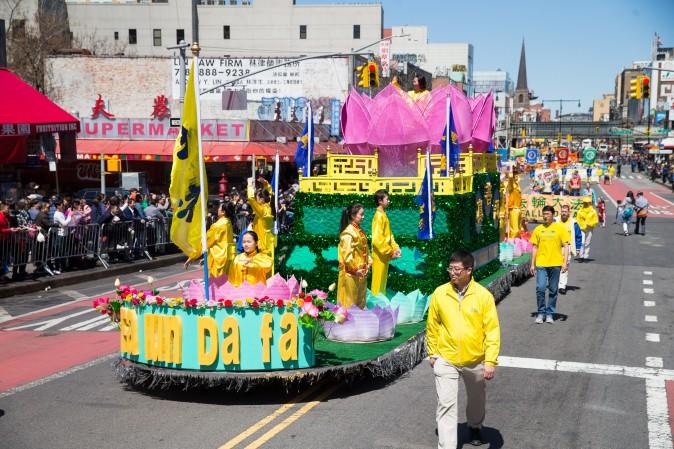 Falun Gong practitioners march in a parade in Flushing, New York, on April 23, 2017, to commemorate the 18th anniversary of the April 25th peaceful appeal of 10,000 Falun Gong practitioners in Beijing. (Larry Dye/The Epoch Times)