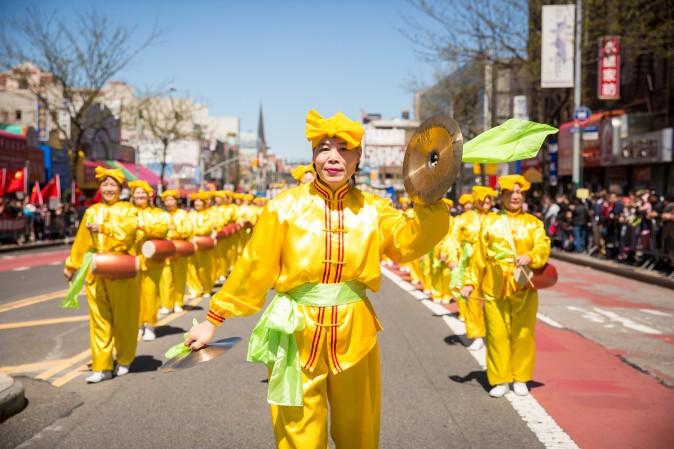 A waist drum troupe, made up of Falun Gong practitioners, marches in a parade in Flushing, New York, on April 23, 2017, to commemorate the 18th anniversary of the April 25th peaceful appeal of 10,000 Falun Gong practitioners in Beijing. (Benjamin Chasteen/The Epoch Times)