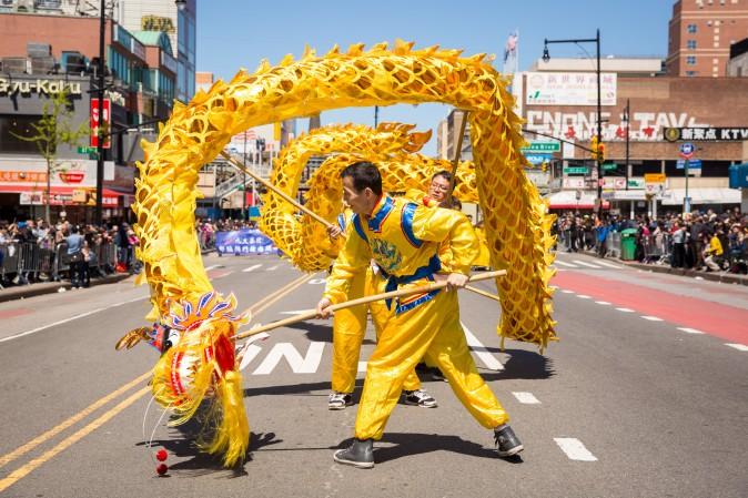 Falun Gong practitioners march in a parade in Flushing, New York, on April 23, 2017, to commemorate the 18th anniversary of the April 25th peaceful appeal of 10,000 Falun Gong practitioners in Beijing. (Benjamin Chasteen/The Epoch Times)