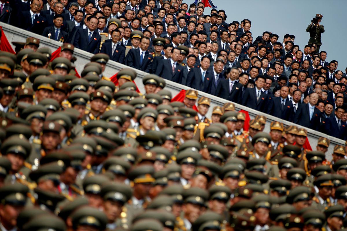 A soldier films North Korean soldiers, officers and high ranking officials attending a military parade marking the 105th birth anniversary of country's founding father Kim Il Sung in Pyongyang, North Korea on April 15, 2017. (REUTERS/Damir Sagolj)